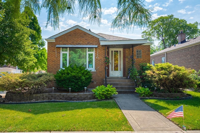 5401 S Nagle Ave, Chicago, IL 60638 - bungalow-style home featuring brick siding and a front lawn