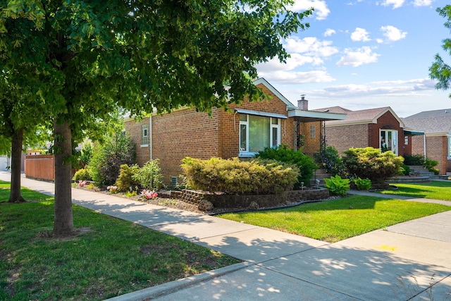 5401 S Nagle Ave, Chicago, IL 60638 - view of front of property featuring brick siding and a chimney