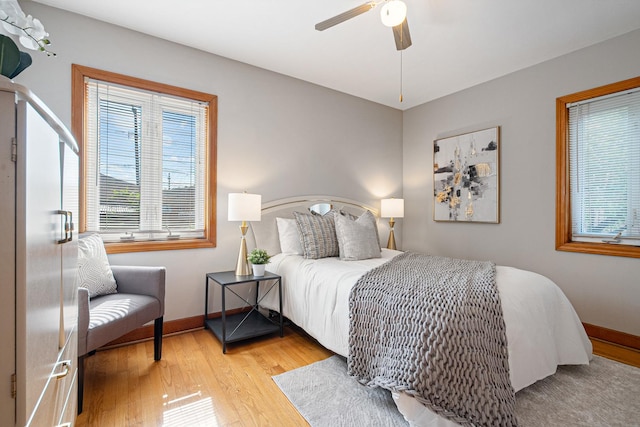5401 S Nagle Ave, Chicago, IL 60638 - bedroom with multiple windows, wood finished floors, and a ceiling fan