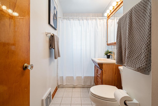 5401 S Nagle Ave, Chicago, IL 60638 - full bathroom featuring vanity, tile patterned floors, and shower / bath combo