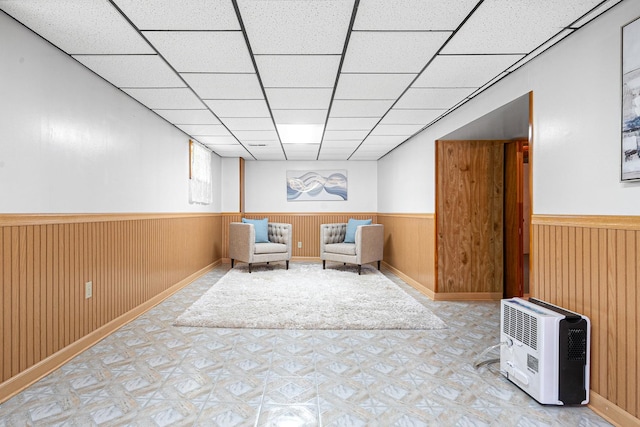 5401 S Nagle Ave, Chicago, IL 60638 - unfurnished room with a wainscoted wall, light flooring, a drop ceiling, wooden walls, and heating unit