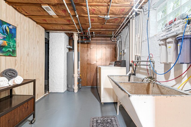 5401 S Nagle Ave, Chicago, IL 60638 - unfinished below grade area featuring gas water heater, wood walls, and washer and dryer