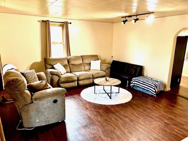 1226 175th St, East Hazel Crest, IL 60429 - living room with arched walkways, wood finished floors, and track lighting