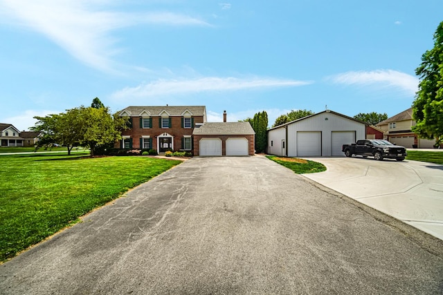 26711 S Greenbriar Dr, Monee, IL 60449 - colonial home with a front yard, brick siding, and a detached garage