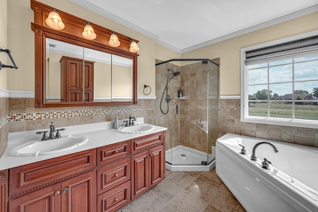 26711 S Greenbriar Dr, Monee, IL 60449 - bathroom featuring tile walls, a stall shower, a garden tub, double vanity, and ornamental molding