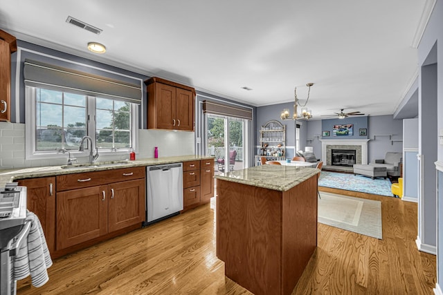 26711 S Greenbriar Dr, Monee, IL 60449 - kitchen featuring stainless steel dishwasher, light wood finished floors, backsplash, ceiling fan, and crown molding