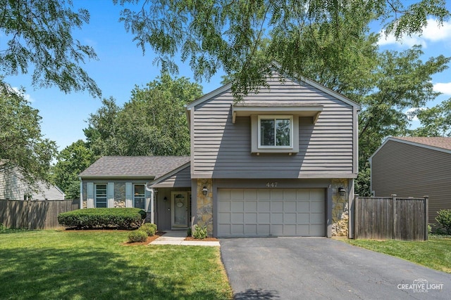 447 Newport Dr, Naperville, IL 60565 - view of front of property featuring stone siding, an attached garage, and driveway