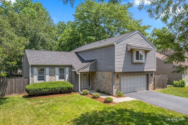 447 Newport Dr, Naperville, IL 60565 - view of front facade with stone siding, driveway, a shingled roof, and a garage