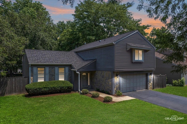 447 Newport Dr, Naperville, IL 60565 - view of front of house with stone siding, driveway, an attached garage, and roof with shingles