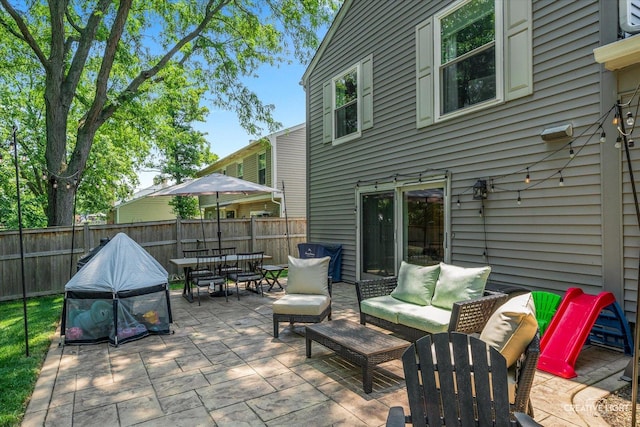 447 Newport Dr, Naperville, IL 60565 - fenced backyard with outdoor dining space, a patio, and an outdoor hangout area