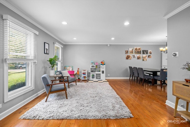 447 Newport Dr, Naperville, IL 60565 - living area featuring crown molding, recessed lighting, wood finished floors, healthy amount of natural light, and a chandelier