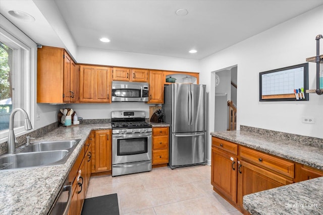 447 Newport Dr, Naperville, IL 60565 - kitchen with appliances with stainless steel finishes, light tile patterned floors, brown cabinets, and recessed lighting