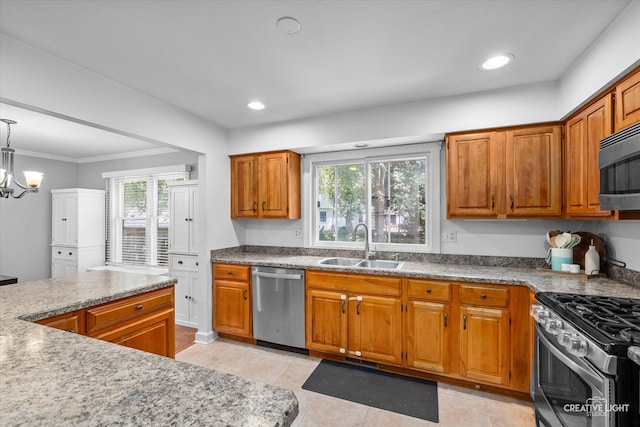 447 Newport Dr, Naperville, IL 60565 - kitchen with stainless steel appliances, brown cabinets, light tile patterned flooring, recessed lighting, and a chandelier