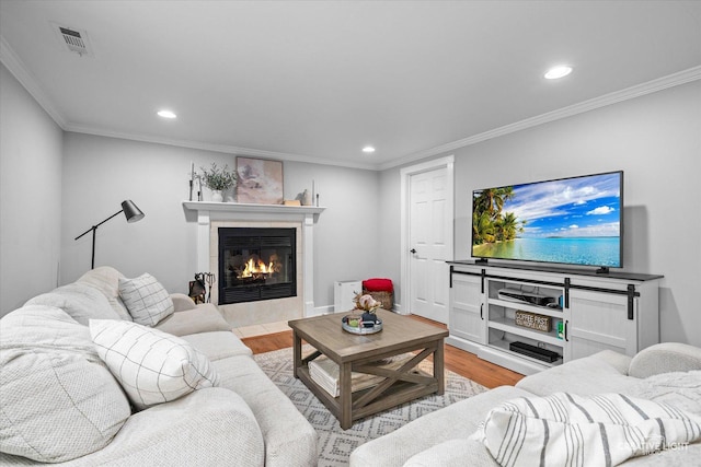 447 Newport Dr, Naperville, IL 60565 - living room with light wood finished floors, a tiled fireplace, recessed lighting, and crown molding