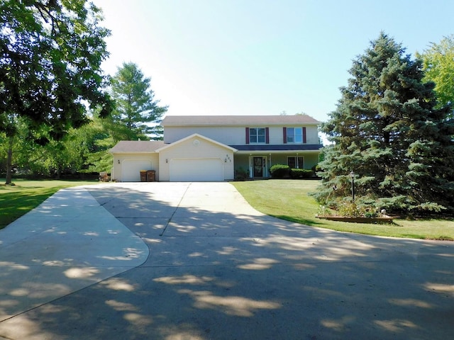 565 Sandra Cir, Freeport, IL 61032 - traditional-style house with a garage, concrete driveway, and a front yard