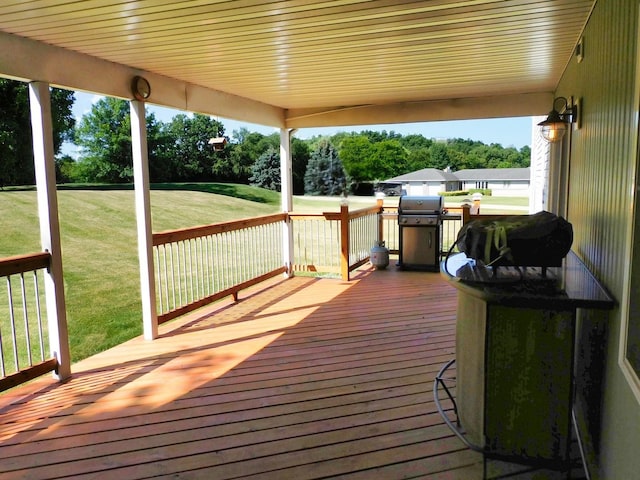 565 Sandra Cir, Freeport, IL 61032 - deck featuring area for grilling, a yard, and view of scattered trees