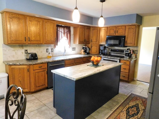 565 Sandra Cir, Freeport, IL 61032 - kitchen featuring appliances with stainless steel finishes, tasteful backsplash, brown cabinets, and a kitchen island
