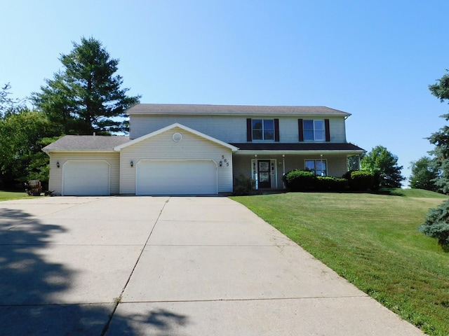565 Sandra Cir, Freeport, IL 61032 - traditional-style home with an attached garage, a front yard, and concrete driveway