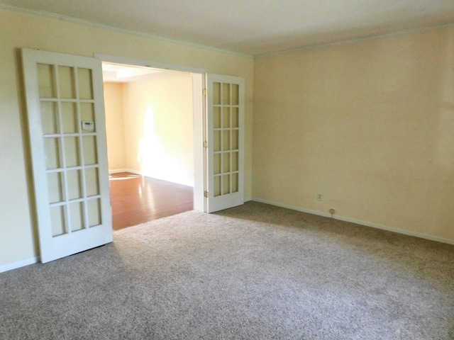 565 Sandra Cir, Freeport, IL 61032 - unfurnished room featuring crown molding, carpet flooring, and french doors