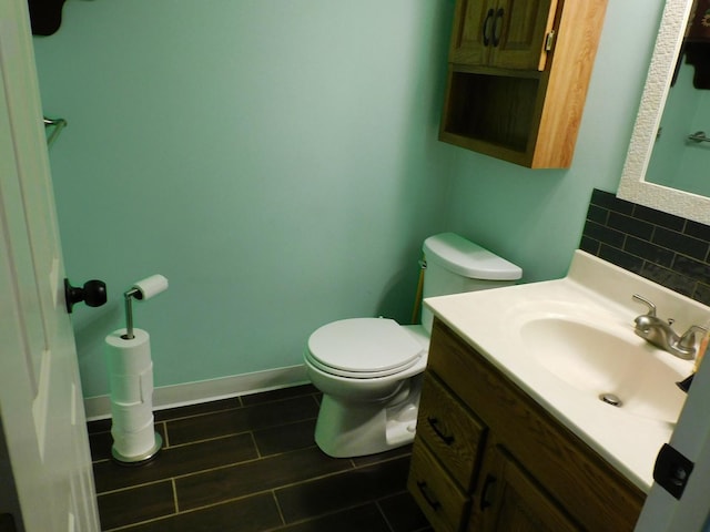 565 Sandra Cir, Freeport, IL 61032 - bathroom featuring vanity, tasteful backsplash, and tile patterned flooring