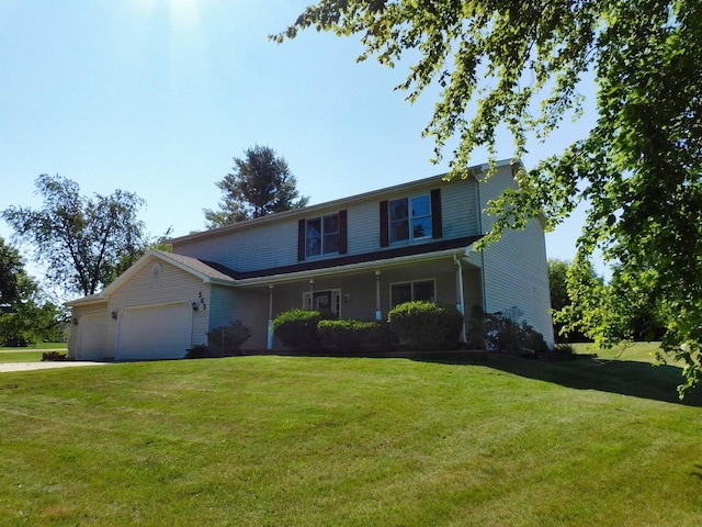 565 Sandra Cir, Freeport, IL 61032 - view of front of property featuring a front lawn, an attached garage, and driveway