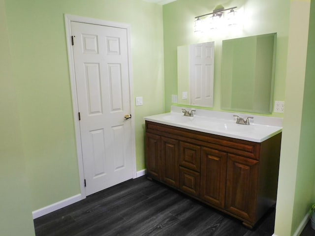 565 Sandra Cir, Freeport, IL 61032 - full bathroom with double vanity and wood finished floors