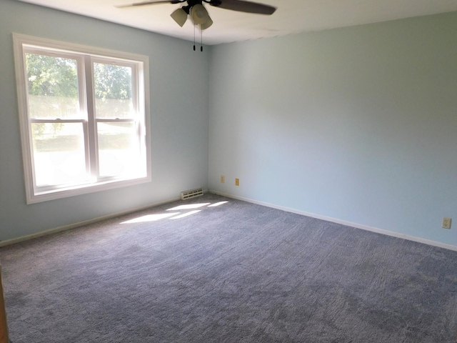 565 Sandra Cir, Freeport, IL 61032 - carpeted spare room with ceiling fan and baseboards