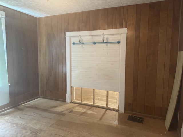 614 N Jackson St, Clinton, IL 61727 - unfurnished room with wooden walls