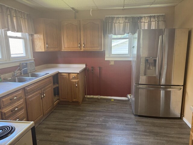 614 N Jackson St, Clinton, IL 61727 - kitchen with stainless steel fridge, dark wood-style flooring, light countertops, brown cabinetry, and a drop ceiling