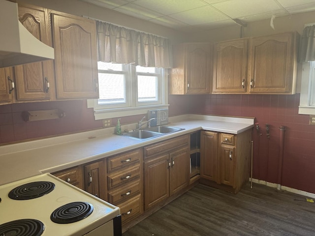 614 N Jackson St, Clinton, IL 61727 - kitchen featuring custom range hood, white electric range, dark wood-style floors, light countertops, and a drop ceiling