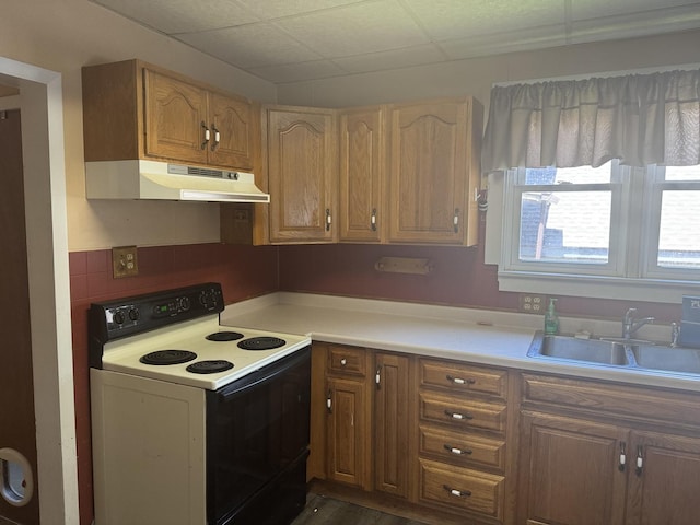 614 N Jackson St, Clinton, IL 61727 - kitchen with white electric range oven, under cabinet range hood, and light countertops