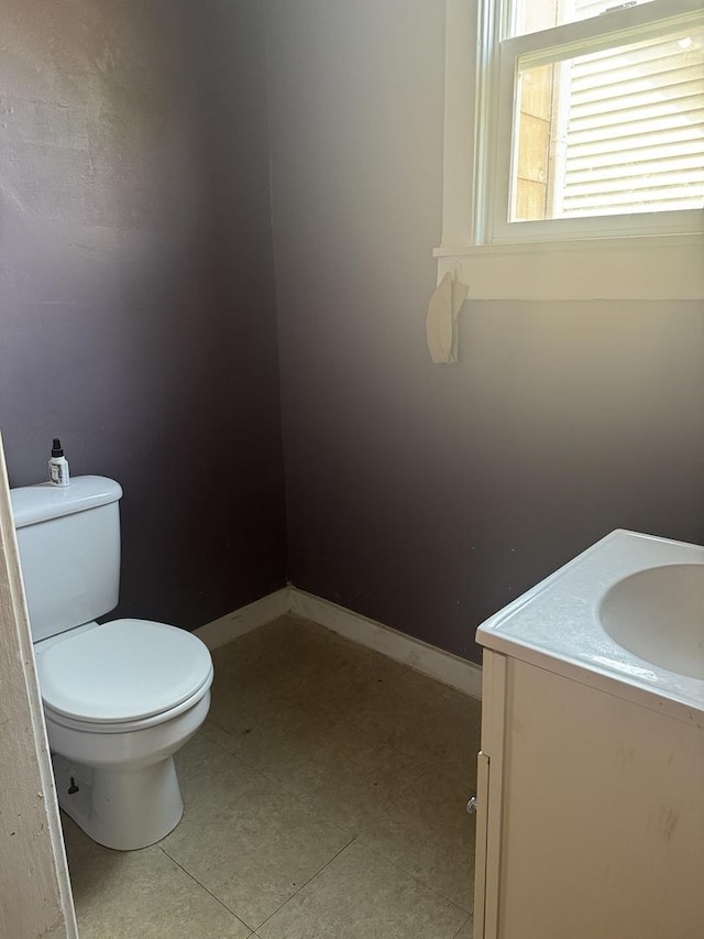 614 N Jackson St, Clinton, IL 61727 - half bathroom featuring vanity and toilet