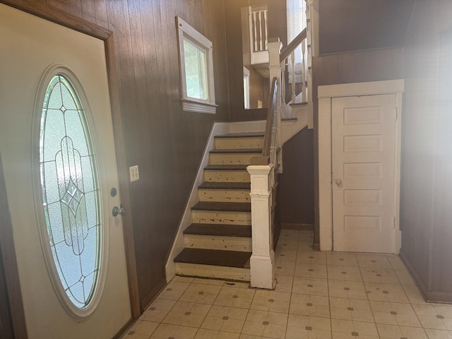 614 N Jackson St, Clinton, IL 61727 - entrance foyer featuring stairs and wood walls