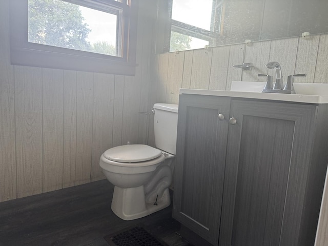 614 N Jackson St, Clinton, IL 61727 - bathroom featuring vanity and wood finished floors