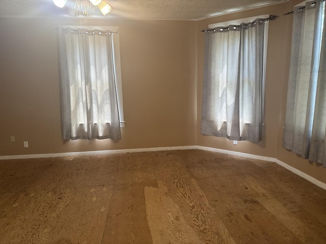 614 N Jackson St, Clinton, IL 61727 - empty room featuring baseboards
