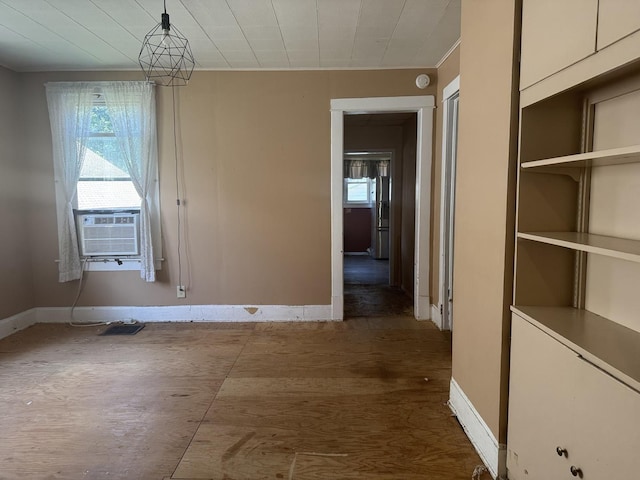 614 N Jackson St, Clinton, IL 61727 - unfurnished dining area with baseboards and cooling unit