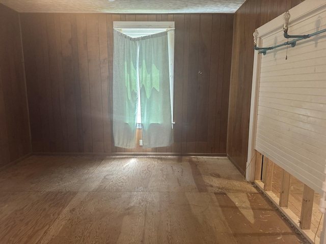 614 N Jackson St, Clinton, IL 61727 - unfurnished room featuring wood walls