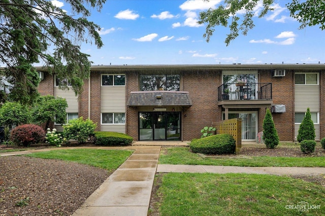 2300 Old Tavern Rd Unit 101, Lisle, IL 60532 - view of front of house featuring brick siding and a front yard