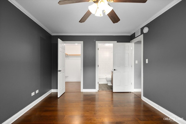 2300 Old Tavern Rd Unit 101, Lisle, IL 60532 - unfurnished bedroom featuring a walk in closet, ornamental molding, wood finished floors, ensuite bath, and a ceiling fan