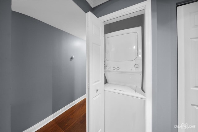 2300 Old Tavern Rd Unit 101, Lisle, IL 60532 - laundry room featuring stacked washing machine and dryer and dark wood-style flooring