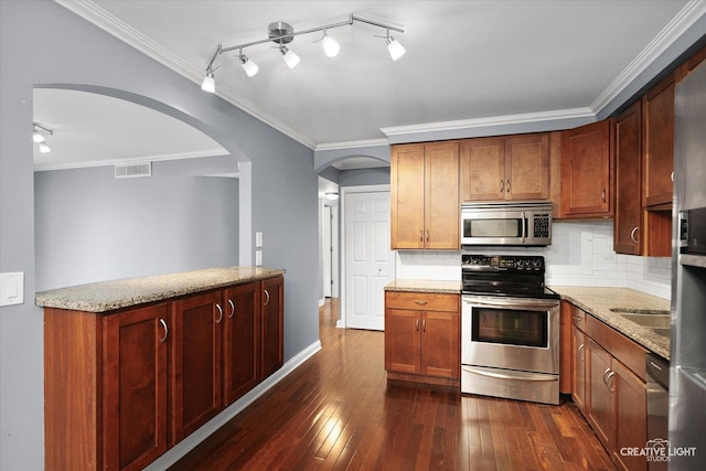 2300 Old Tavern Rd Unit 101, Lisle, IL 60532 - kitchen with appliances with stainless steel finishes, arched walkways, dark wood-type flooring, backsplash, and light stone counters