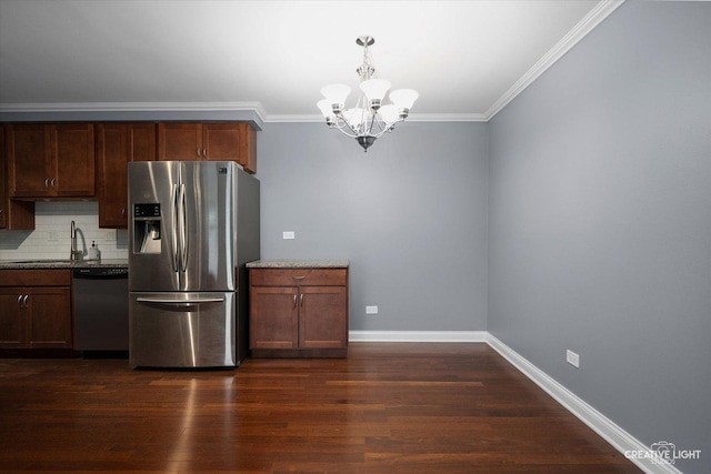 2300 Old Tavern Rd Unit 101, Lisle, IL 60532 - kitchen with appliances with stainless steel finishes, a chandelier, backsplash, dark wood-style floors, and ornamental molding