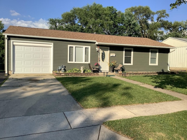 427 Kenyon Ave, Romeoville, IL 60446 - single story home with a front yard, concrete driveway, an attached garage, and roof with shingles