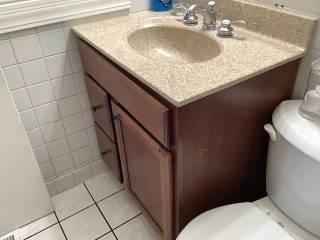 427 Kenyon Ave, Romeoville, IL 60446 - half bath featuring vanity and tile patterned floors