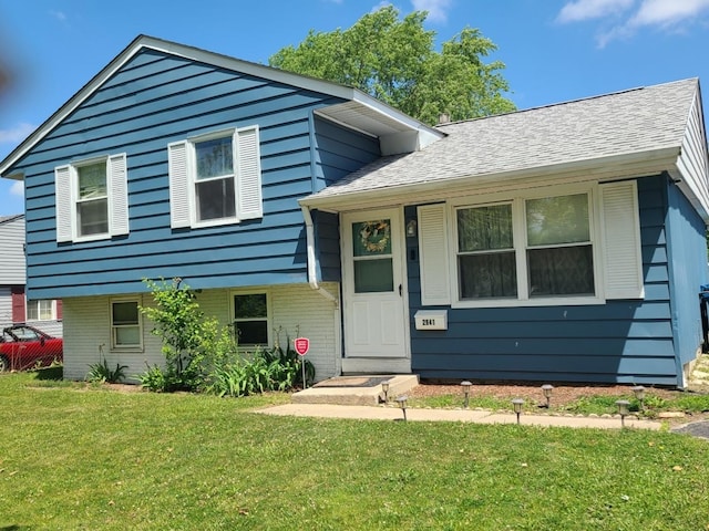 2941 225th St, Sauk Village, IL 60411 - tri-level home featuring a front lawn, brick siding, and roof with shingles