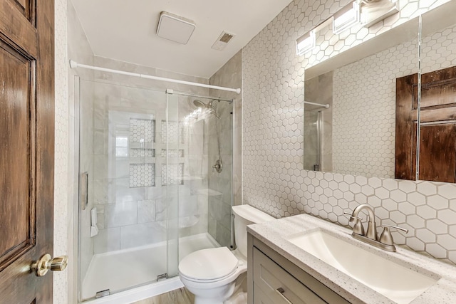 43173 N Lake Ave, Antioch, IL 60002 - full bathroom featuring tile walls, tasteful backsplash, vanity, and a shower stall