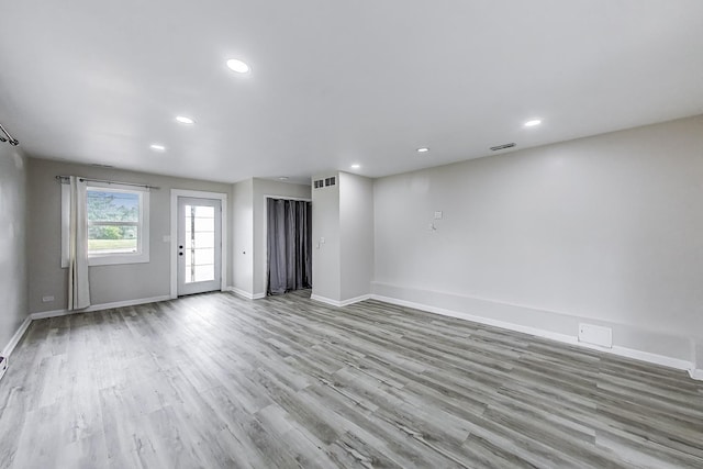 43173 N Lake Ave, Antioch, IL 60002 - unfurnished living room featuring wood finished floors and recessed lighting