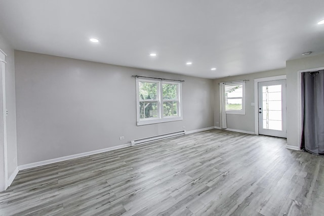43173 N Lake Ave, Antioch, IL 60002 - empty room with a baseboard radiator, wood finished floors, and recessed lighting