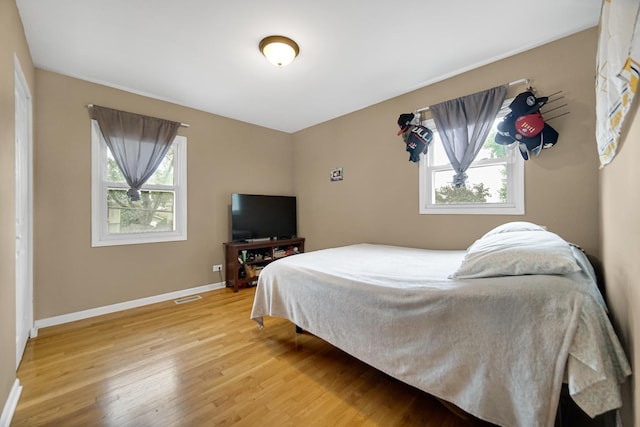 609 W Romeo Rd, Romeoville, IL 60446 - bedroom featuring wood finished floors and baseboards