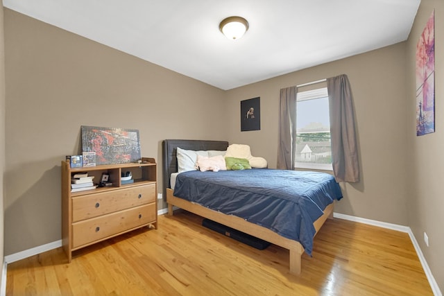 609 W Romeo Rd, Romeoville, IL 60446 - bedroom featuring baseboards and light wood-style floors